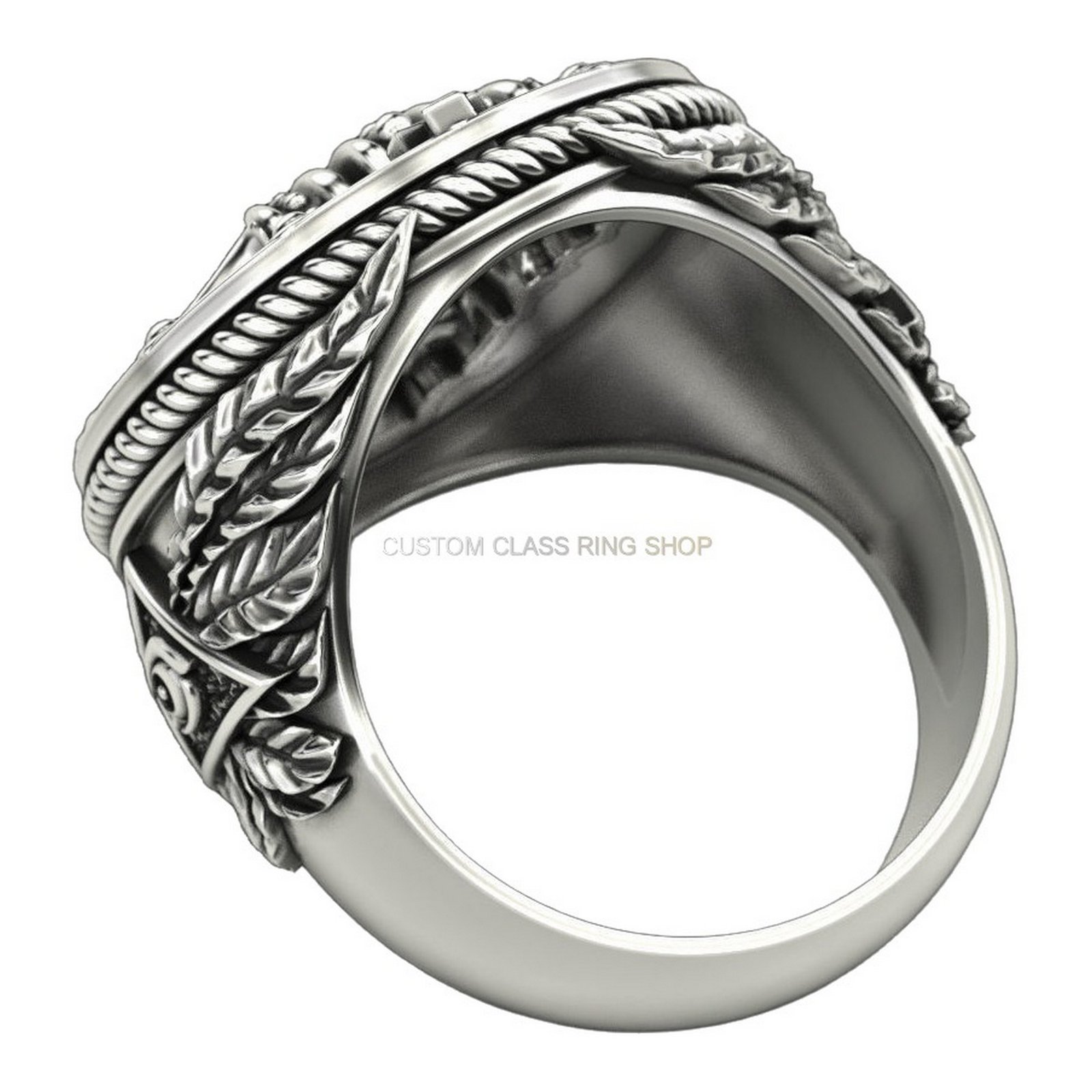 Mens sterling silver crowned skull ring, side profile showing band and scrollwork