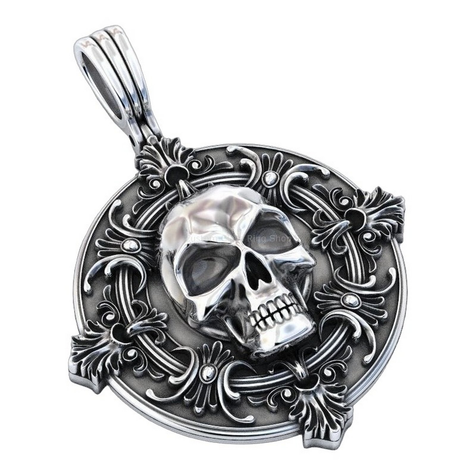 Sterling silver skull ornament pendant, angled three-quarter view with pendant facing left