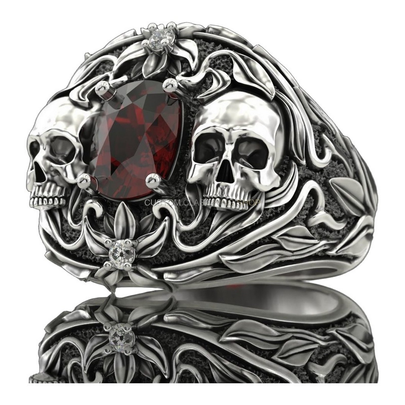 Mens oxidized silver dual skull ring with garnet center and filigree border